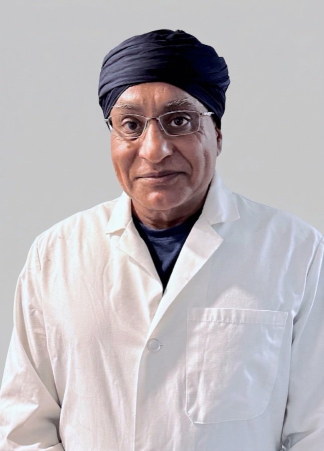 Dr. Gurpreet Singh Padda, MD, MBA, MHP, wearing a white coat