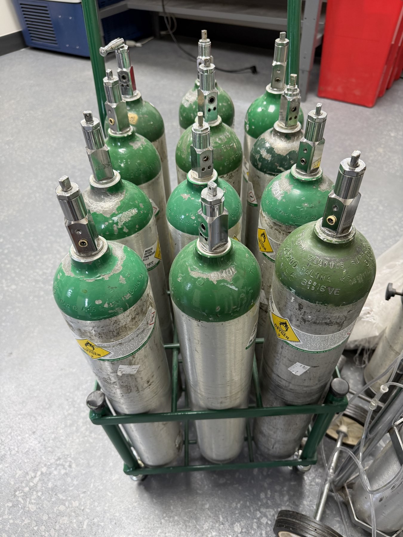 Rack of medical oxygen cylinders with regulators at the Headache Express clinic in St. Louis