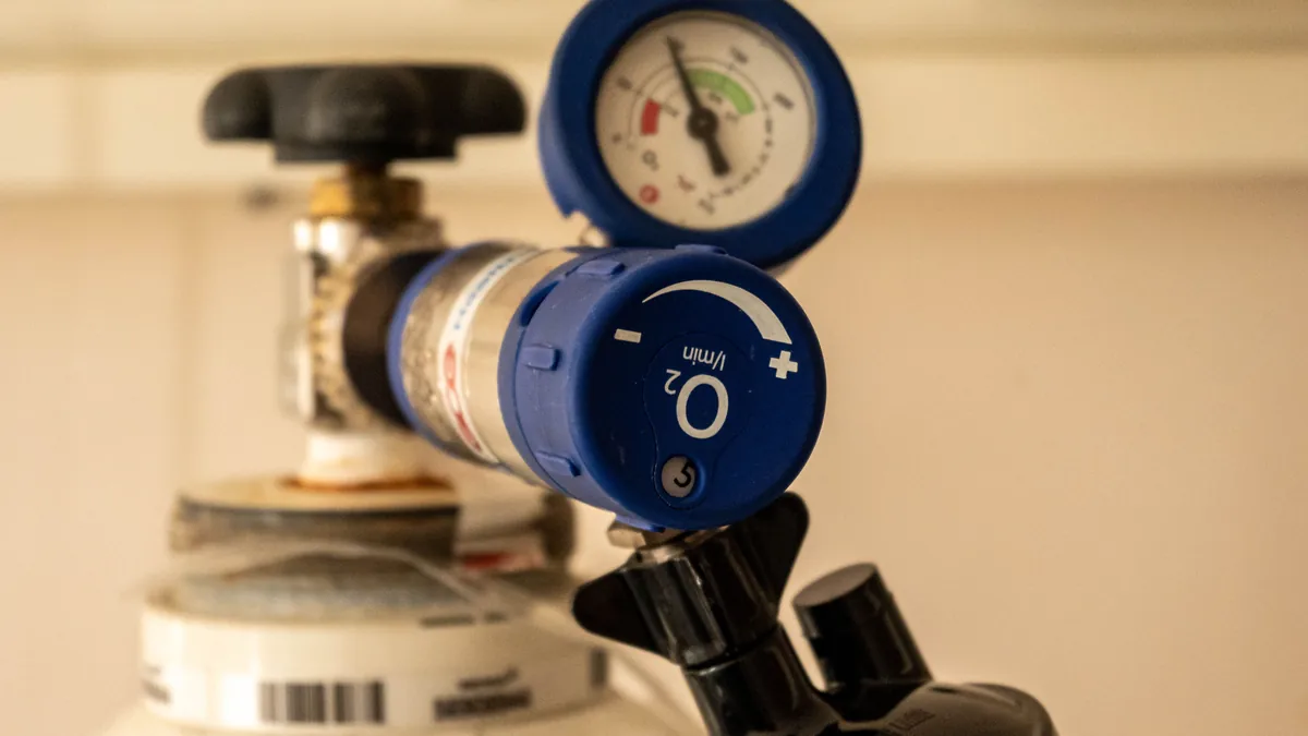 Medical oxygen cylinder with a pressure gauge and flow regulator