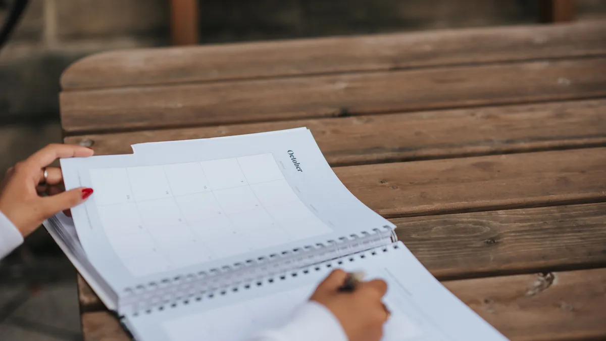 A person flips through a monthly planner to track how long headache relief lasts